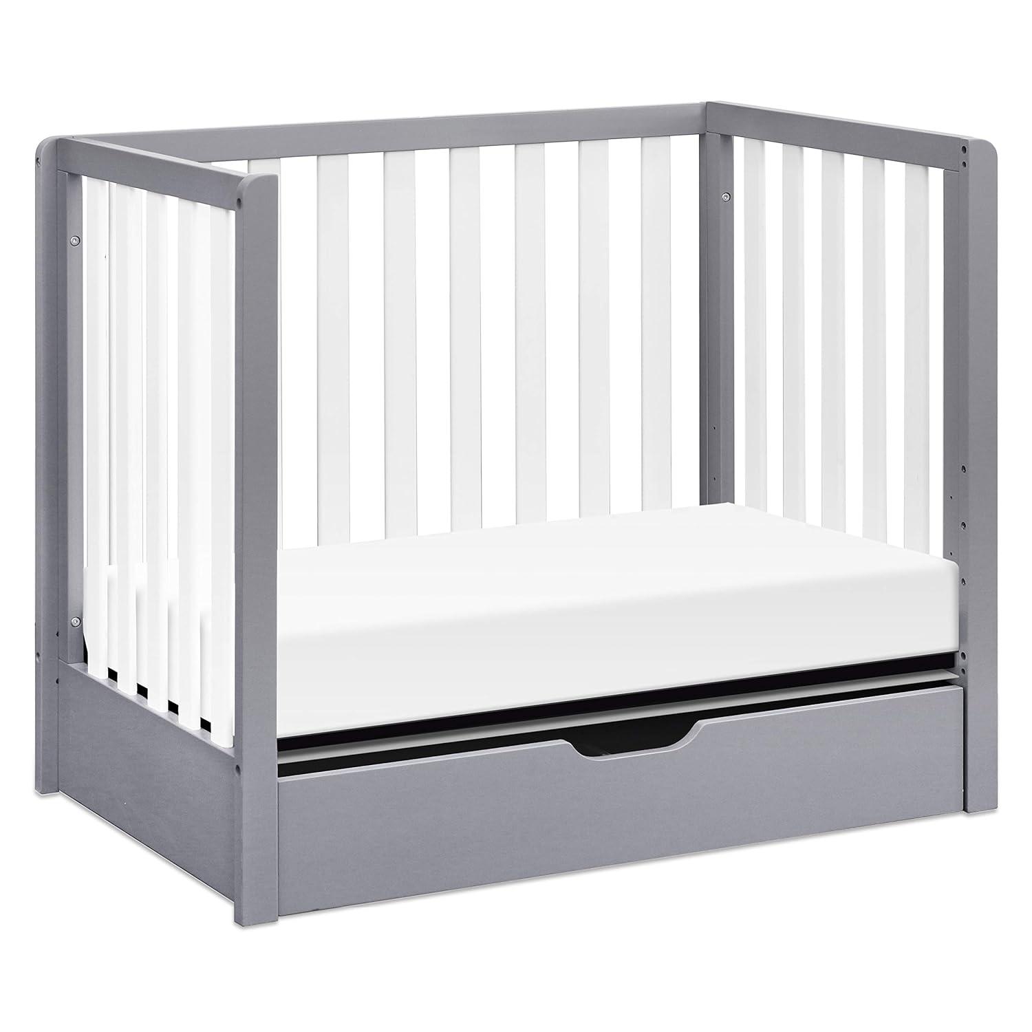 imageCarters by DaVinci Colby 4in1 Convertible Mini Crib with Trundle Drawer in Grey and White Greenguard Gold Certified Undercrib StorageGray and White